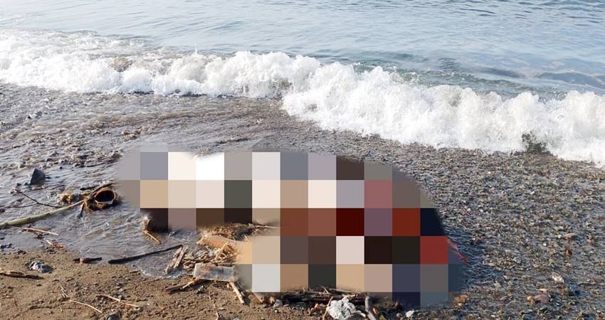 Sosok Mayat berjenis kelamin perempuan ditemukan di tepi pantai, Desa Biluhu Barat, Kabupaten Gorontalo, Jum'at (31/05/2024. ( Foto: Moge Manggasara untuk Gorontalo Pos).