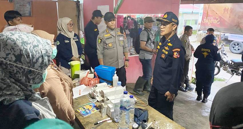 Tim DVI Pusdokkes Polri saat kolaborasi dengan Polda Gorontalo saat ini ditugaskan melakukan evakuasi dan identifikasi korban longsor di tambang Suwawa Timur, Kabupaten Bone Bolango, Kamis (11/7/2024. (Foto: Humas Polda Gorontalo/For Gorontalo Post).