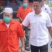 Dua tersangka tambang emas illegal di Desa Batu Kramat Kecamatan Paguyaman, Kabupaten Boalemo, Provinsi Gorontalo resmi ditahan Polres Boalemo, Rabu (24/12/2025). (Foto: Roy/Gorontalo Post)