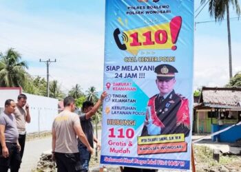 Baliho sosialisasi Layanan Kepolisian 110 di berbagai titik strategis di wilayah hukum Polsek Wonosari.