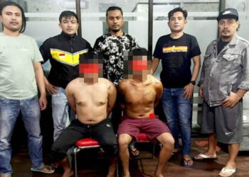 Tersangka dugaan pembobolan minimarket atau gerai Alfamart di wilayah Kabupaten Gorontalo saat diamankan polisi.